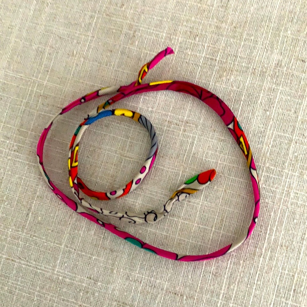 Hermes Twilly String.   Hermès silk.  Bracelet, purse accessory.  Many uses!